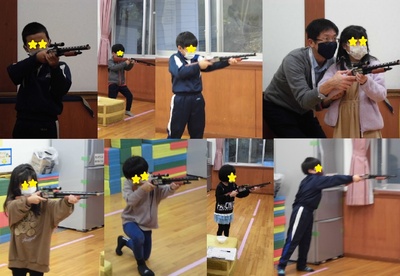 子どもたちが一人だったり先生に支えてもらいながら銃を構える様子の写真