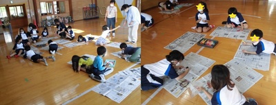 児童センターのプレイルームにて、子どもたちが新聞紙を広げて傘袋に絵を描いている様子